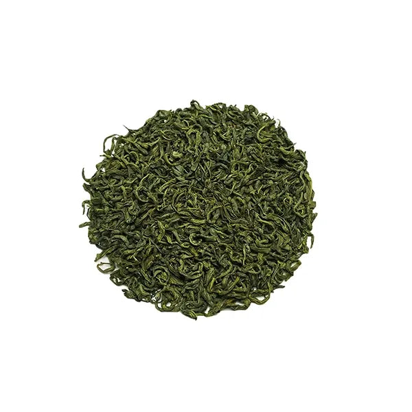 Golden Mountain loose leaf green tea with vibrant, tightly rolled leaves.