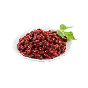 Glossy sweet red beans in syrup, served in a white dish, perfect as a dessert topping or milk tea ingredient.