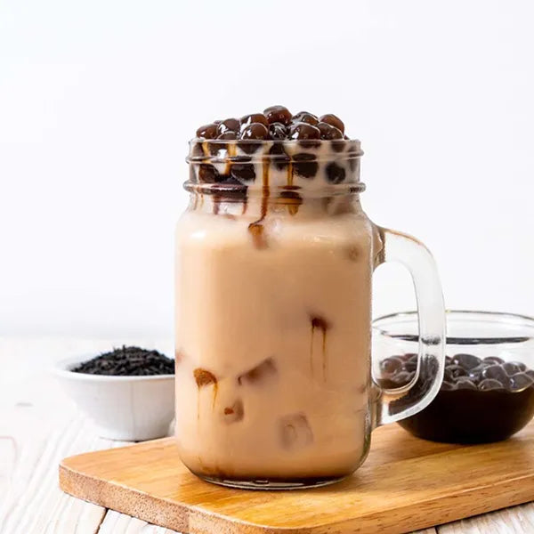 Charcoal roasted oolong pearl milk tea with strong tea aroma and chewy tapioca pearls.