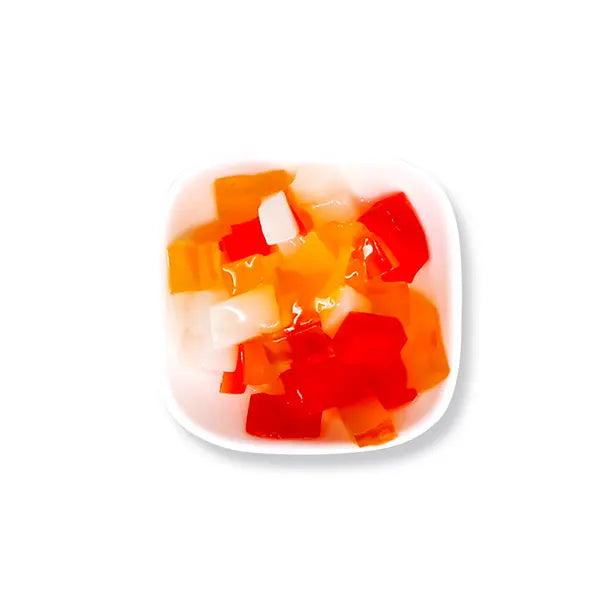 Chewy and colorful rainbow coconut jelly cubes in red, orange, and white, perfect as a topping for bubble tea, smoothies, and fruit teas.