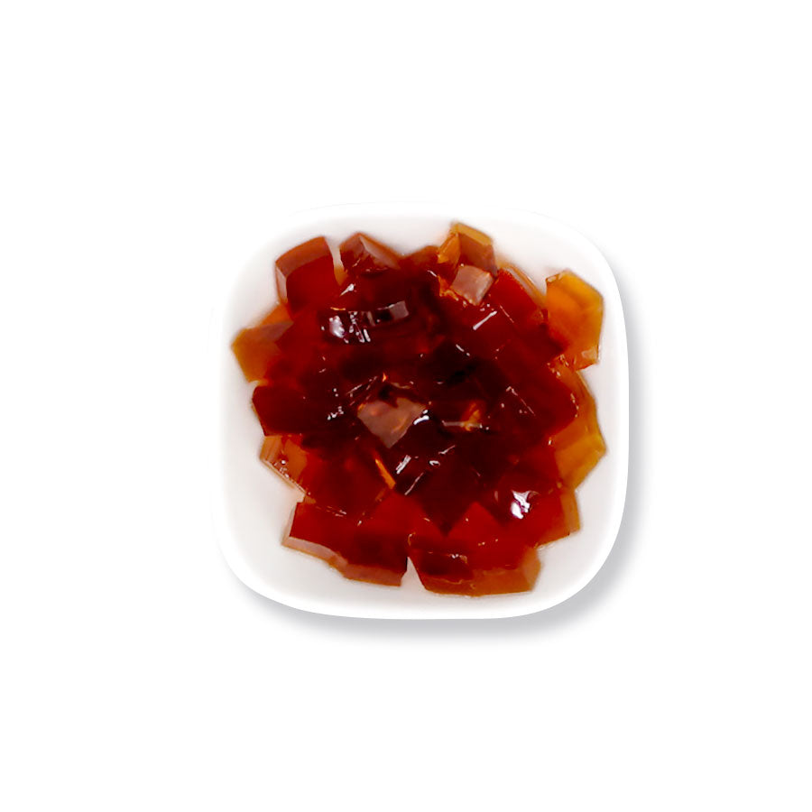 Coffee jelly cubes with a rich coffee aroma and chewy texture, perfect as a topping for bubble tea, iced coffee, and desserts.