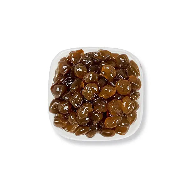 Brown sugar agar boba with glossy texture, rich caramel flavor, perfect as a chewy topping for milk tea or dessert drinks.