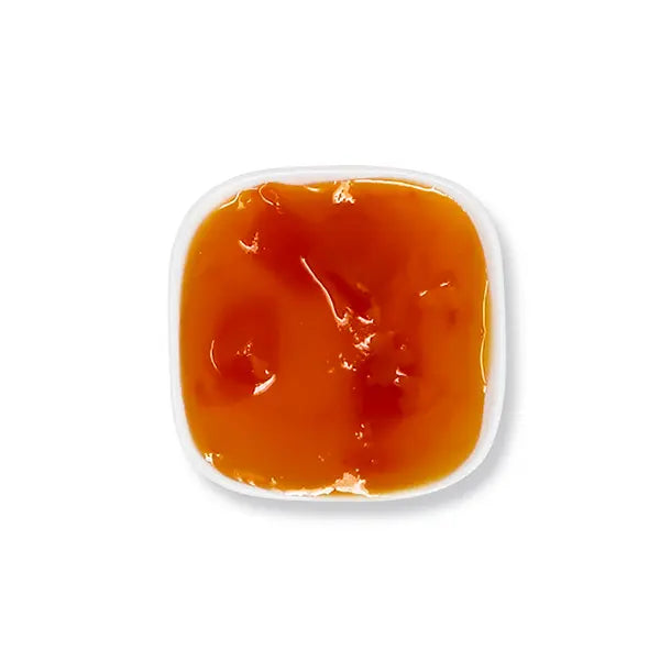 Golden mango jam with silky texture and mango bits, ideal for fruit teas, yogurt, cheese drinks, smoothies, and desserts.