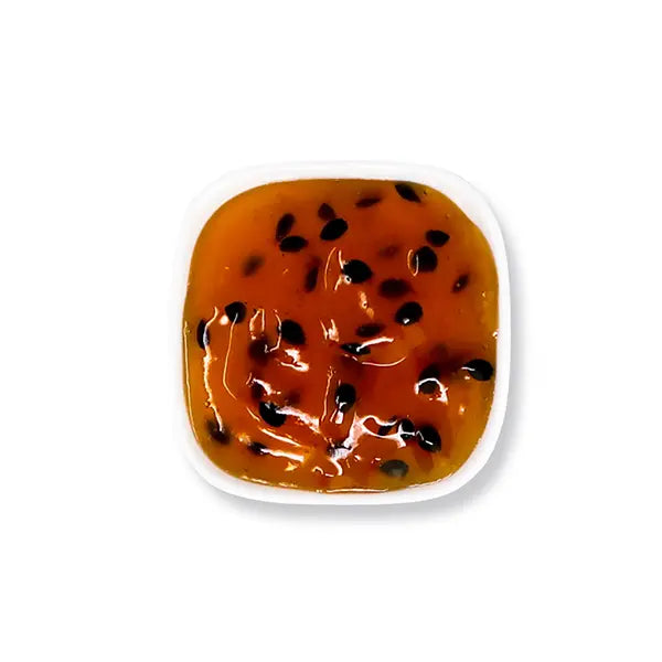 Passion fruit jam with pulp and seeds, offering tangy freshness, perfect for tea, yogurt, sparkling drinks, and desserts.