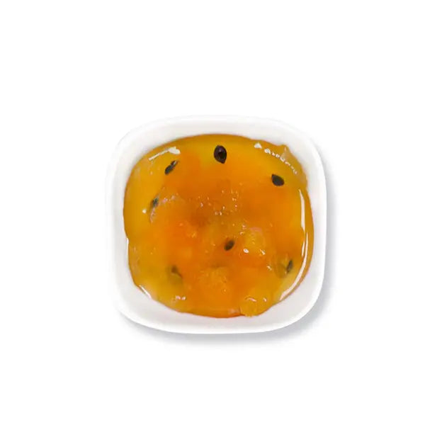 Bright tropical jam with visible passionfruit seeds, great as topping for fruit tea and shaved ice.