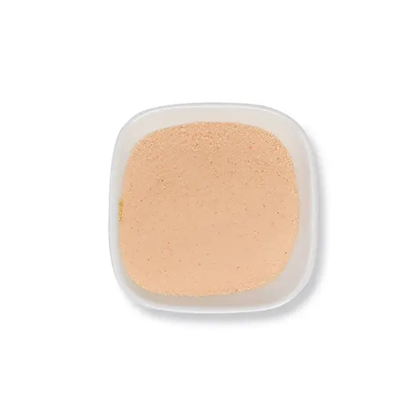 Smooth mango powder with natural orange tone, ideal for smoothies, puddings, and refreshing fruit drinks.