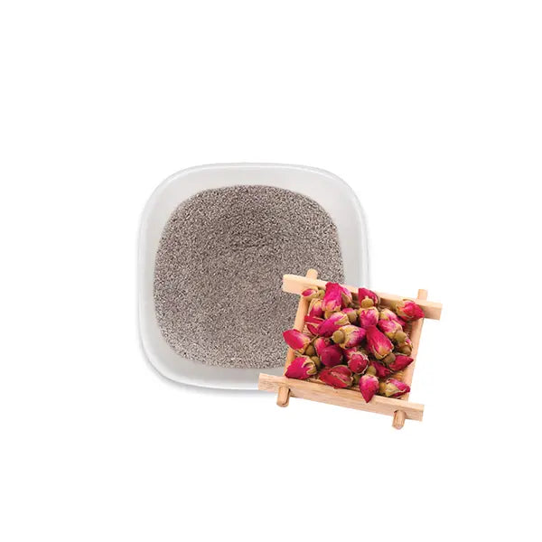Rose milk tea powder with rose buds, offering floral aroma and creamy flavor for drinks and desserts.
