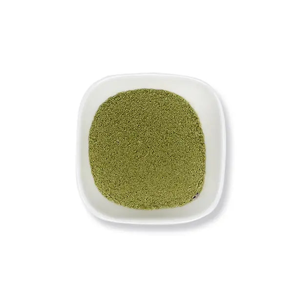 Fine matcha latte powder with vibrant green color, ideal for hot and cold drinks or dessert recipes.