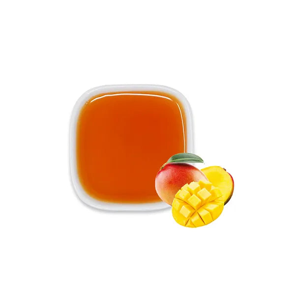 Mango syrup with fresh mango, showing tropical aroma and rich golden hue.