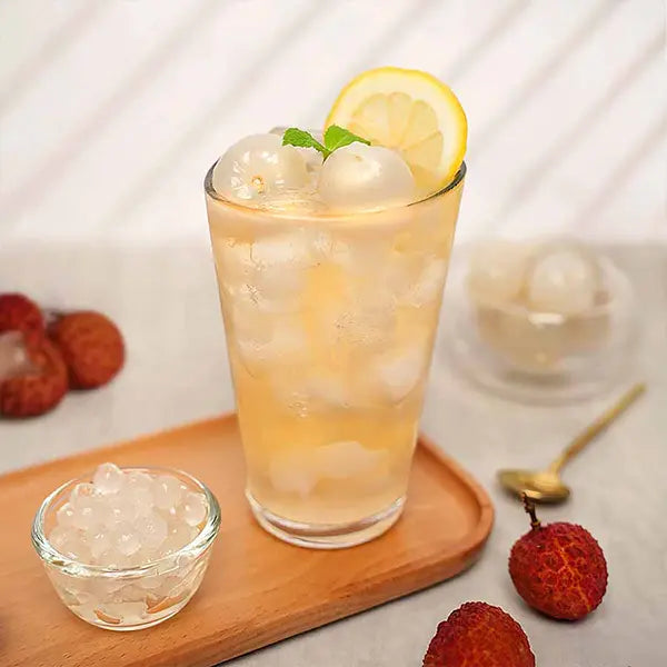 Sparkling pineapple drink with lemon and ice – tangy and refreshing.
