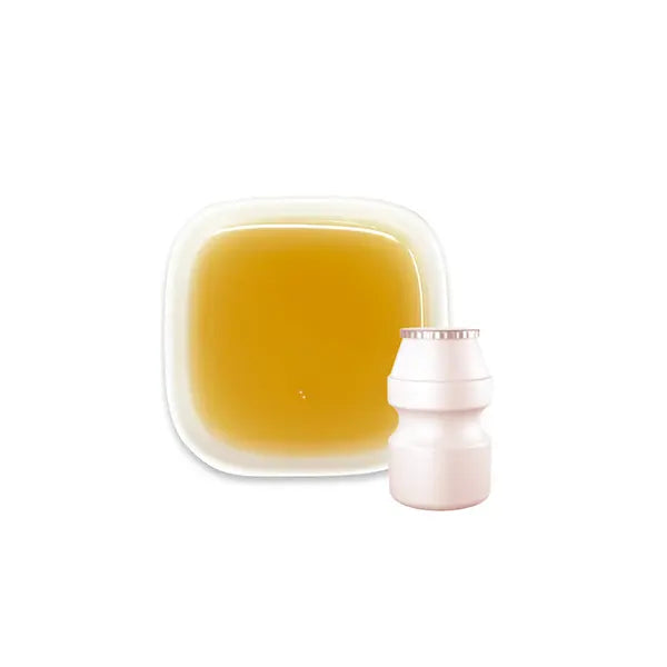 Yogurt syrup paired with yakult-style bottle – creamy beige tone, perfect for fizzy or tangy drinks.