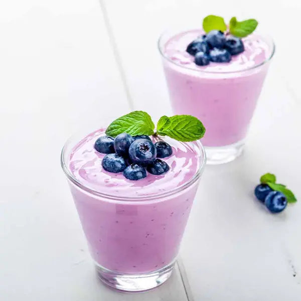 Blueberry yogurt smoothie with mint – dreamy purple-red hue, refreshing and flavorful.