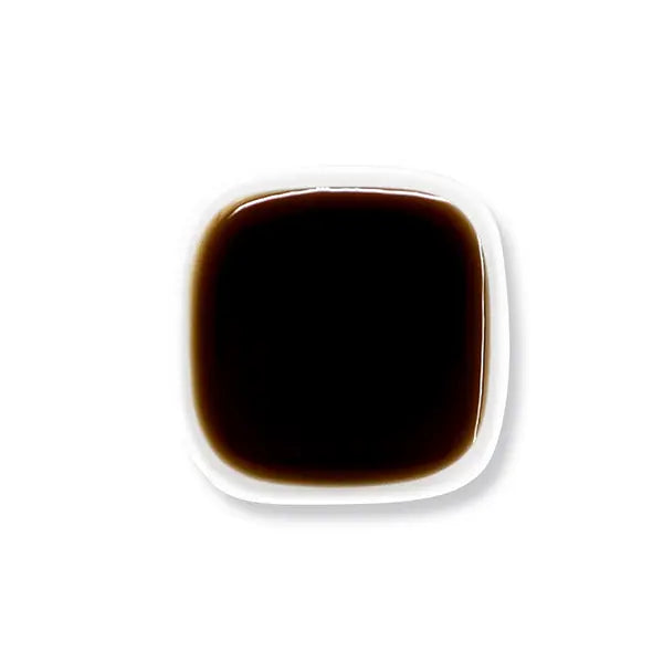 Top view of brown sugar syrup showing glossy dark caramel texture.
