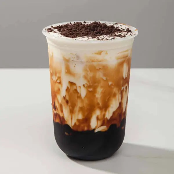 Tiger sugar drink with cream topping and crushed OREO – layered and eye-catching.