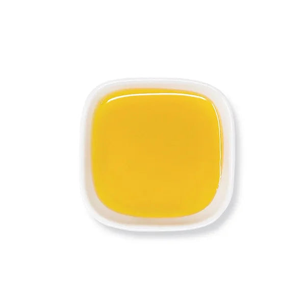 Top view of pumpkin spice syrup in golden hue with even consistency.