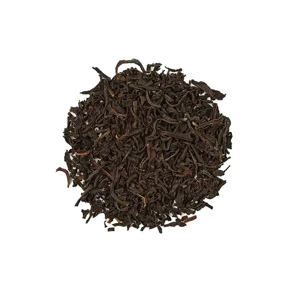 Loose leaf Earl Grey tea with deep black hue and bright bergamot notes.