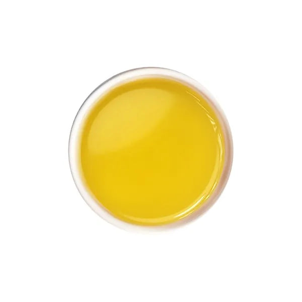Brewed Golden Mountain green tea with clear golden liquor and floral aroma.