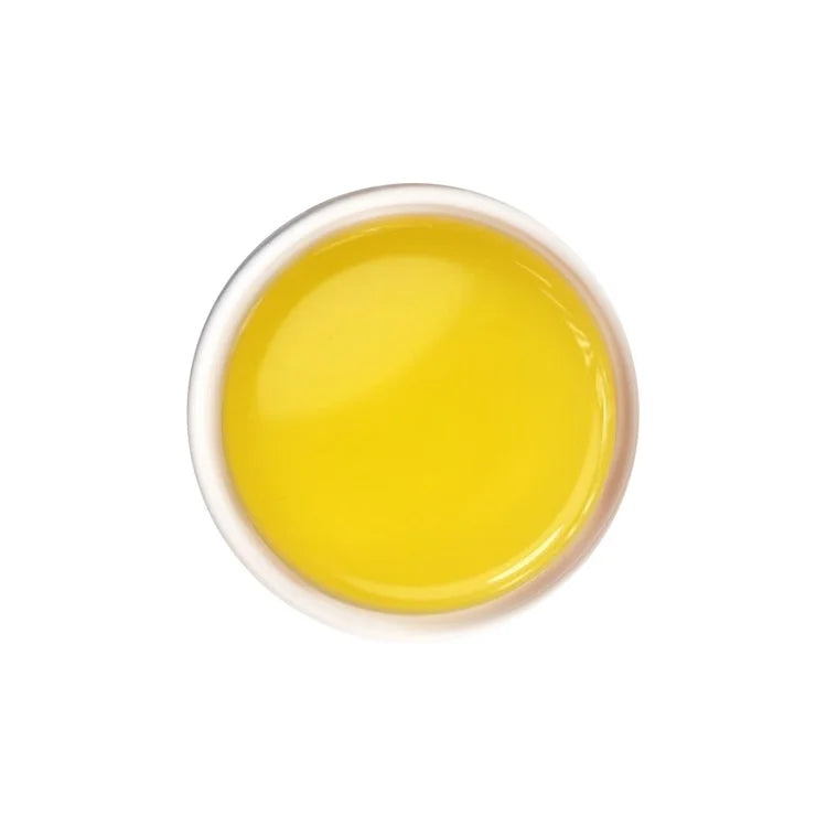 Brewed jasmine green tea with clear pale yellow hue and fragrant aroma.