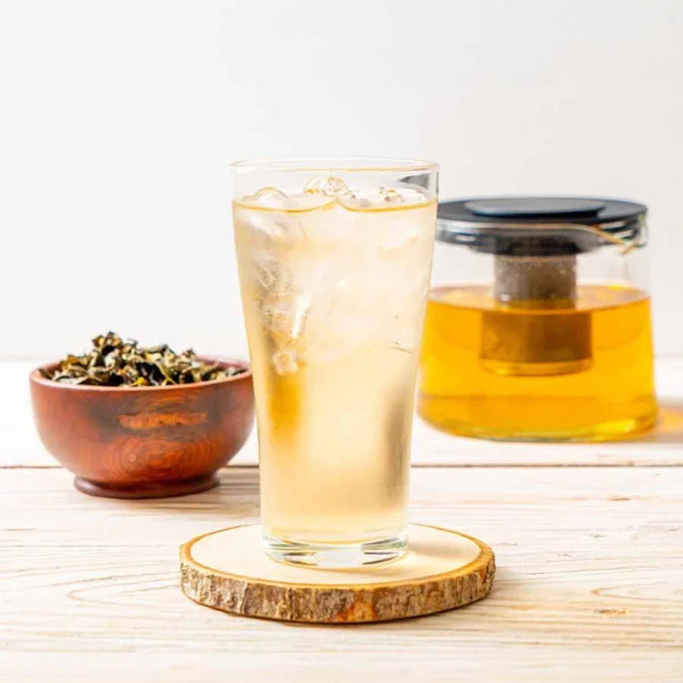 Finished jasmine green tea drink served with ice and pot – refreshing presentation.