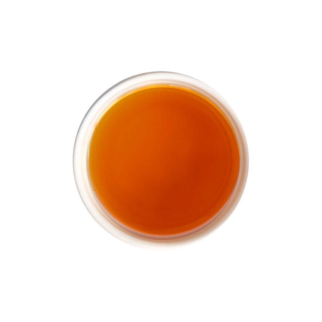 Brewed osmanthus oolong tea with bright golden hue and floral aroma.