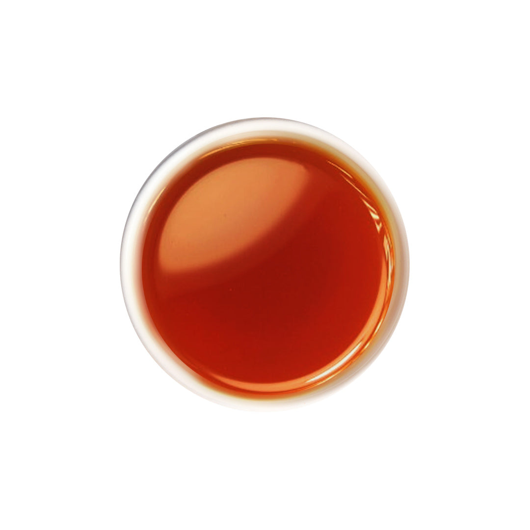 Brewed rose Ceylon tea with bright reddish color and floral notes.